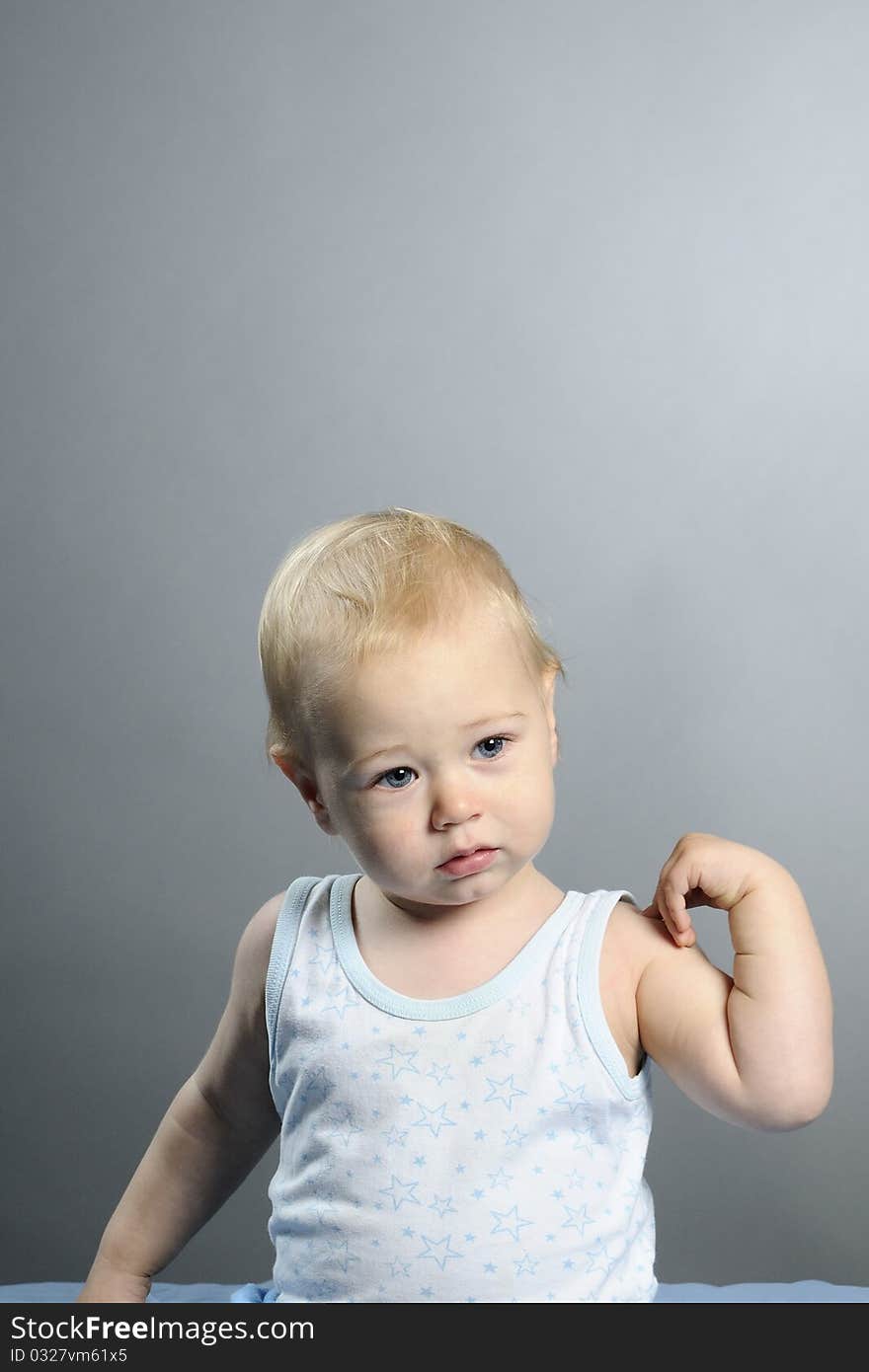 Beautiful baby boy posing in studio. Beautiful baby boy posing in studio