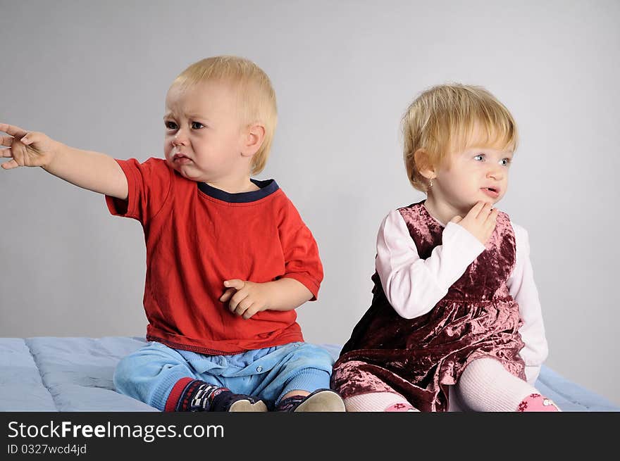 White baby girl and boy eating and asking for food. White baby girl and boy eating and asking for food