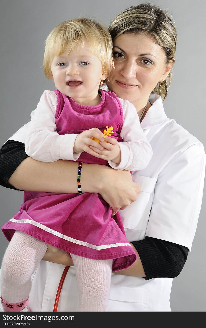 White doctor working with blonde girl. White doctor working with blonde girl