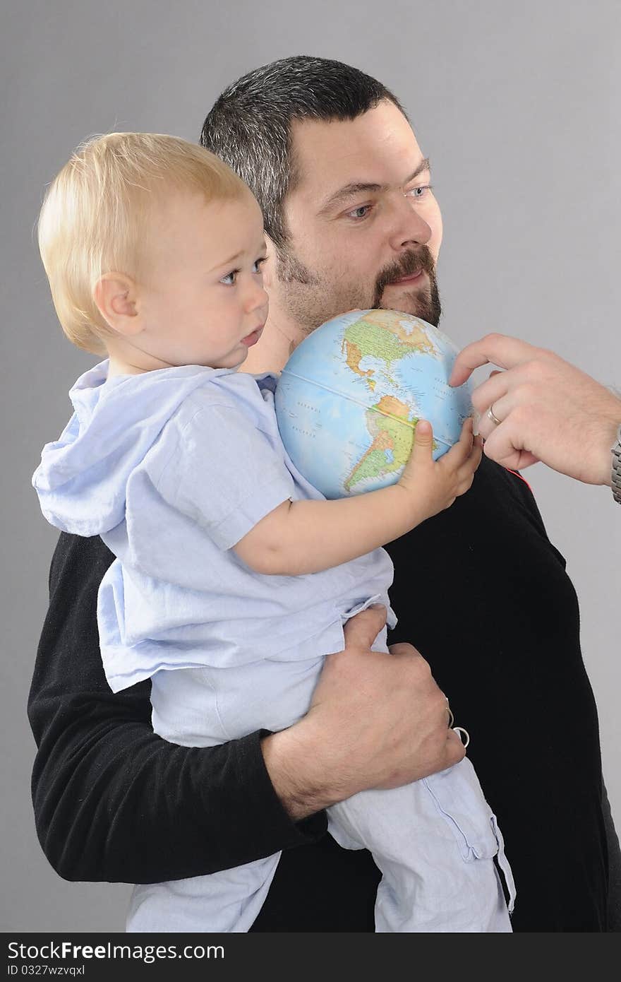 Beautiful baby boy having fun with earth. Beautiful baby boy having fun with earth