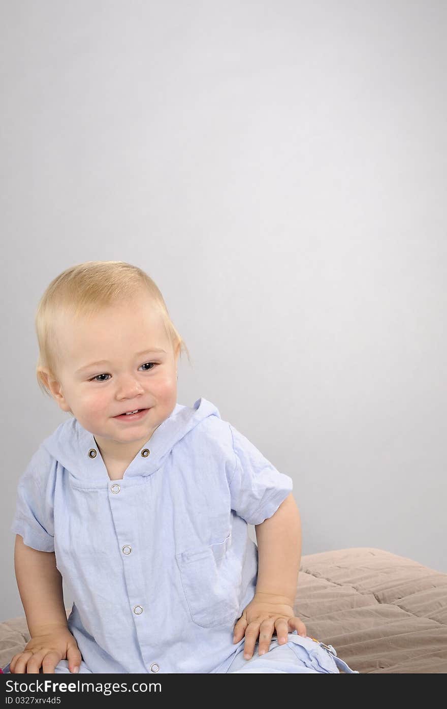 Blonde baby boy playing