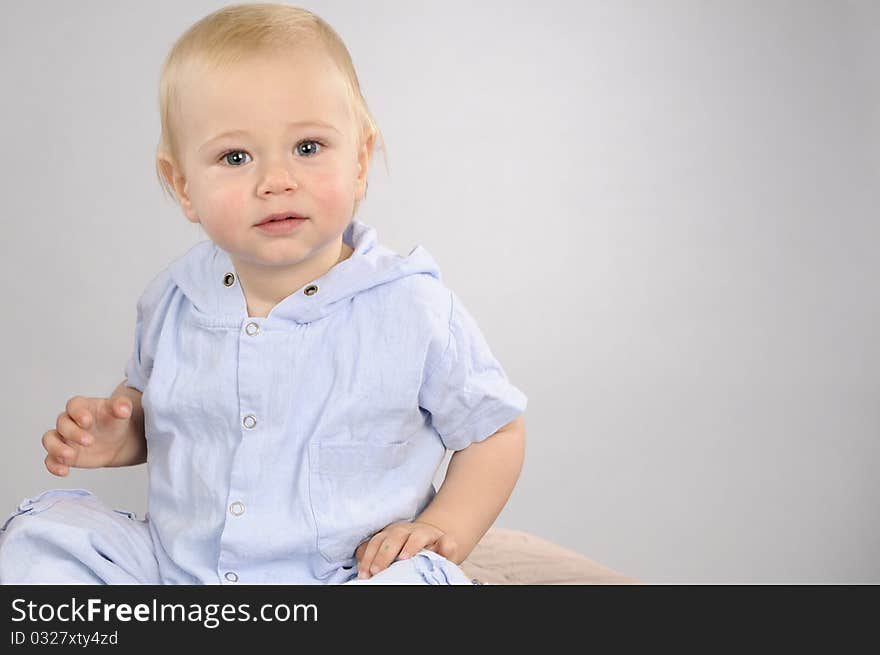 Cheerful baby boy posing