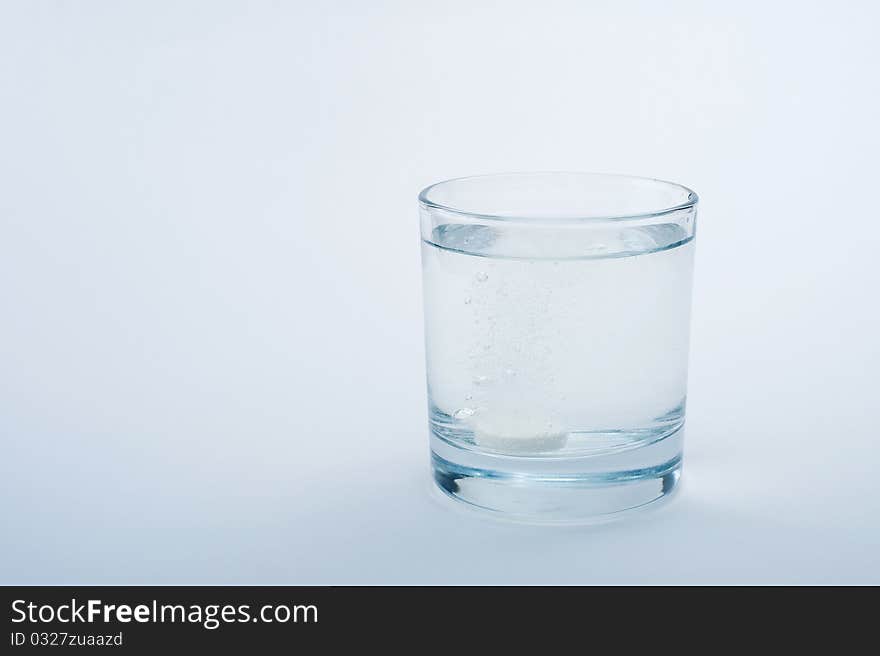 Water In A Glass On A Blue Background