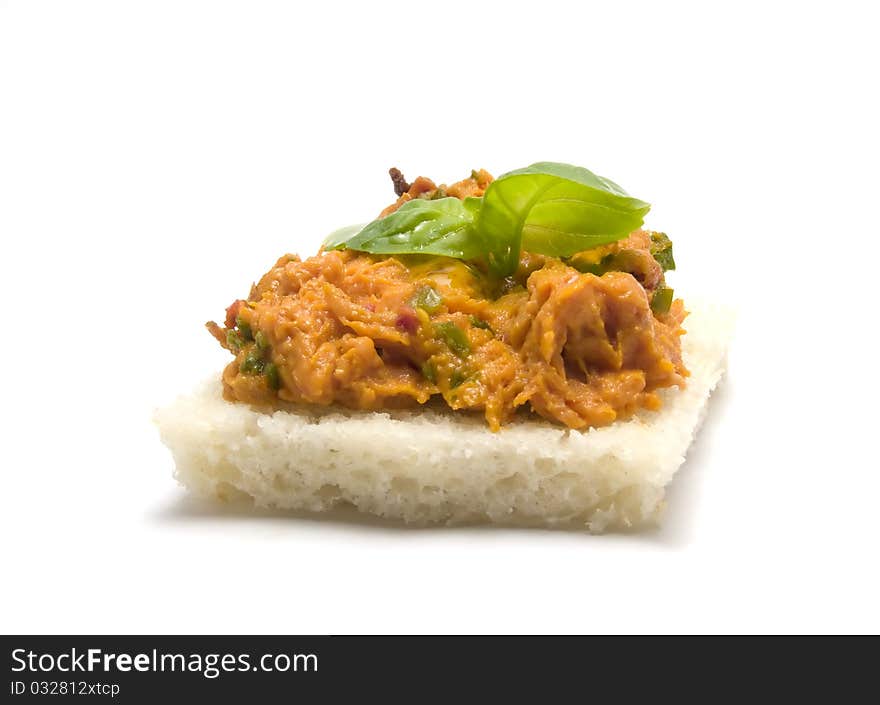 Slice of bread with minced meat and leaves of basil. Slice of bread with minced meat and leaves of basil