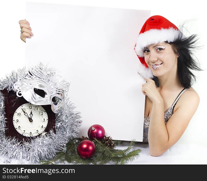 Girl in a Santa s hat holding a tag