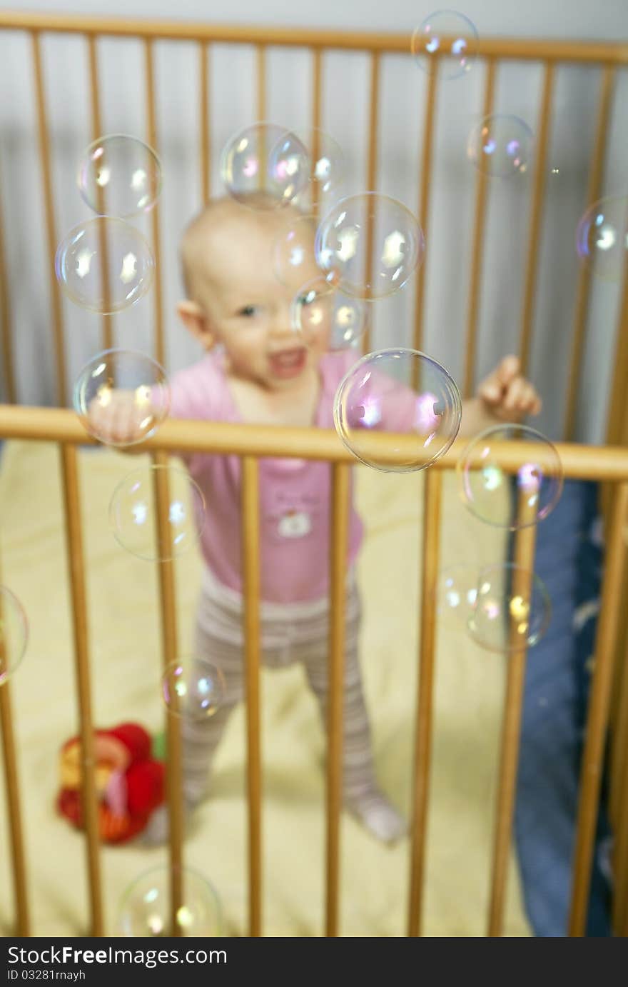 Baby and bubbles.Bubbles in focus, baby out of focus. Baby and bubbles.Bubbles in focus, baby out of focus.