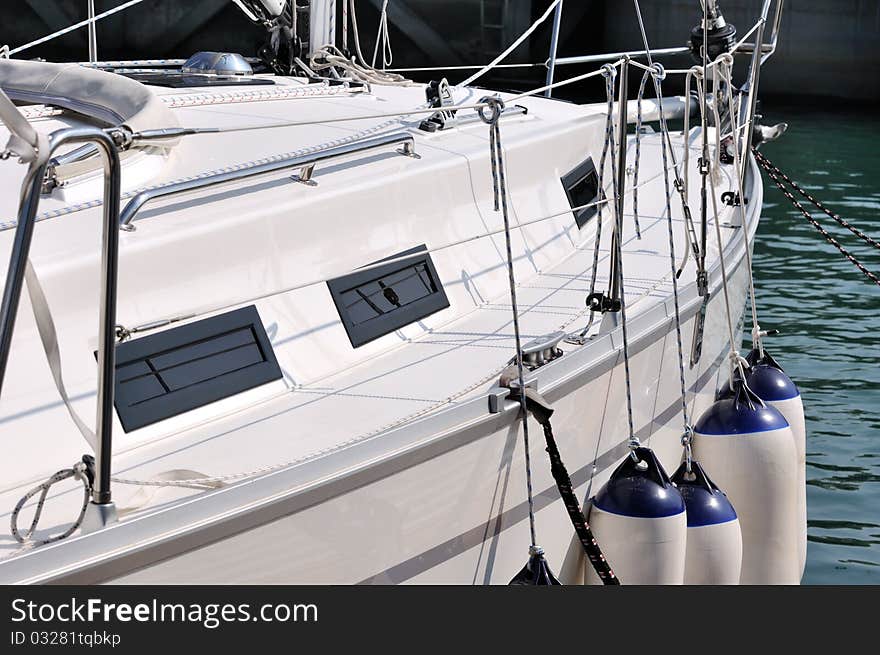 A White Yacht In Harbor