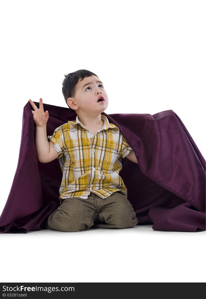 Cute boy kneelin in studio looking up, isolated on white background. Cute boy kneelin in studio looking up, isolated on white background