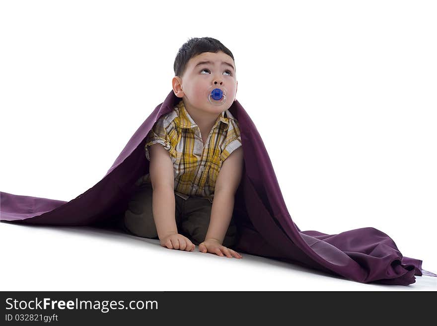 Cute boy with soother looking up, isolated on white background