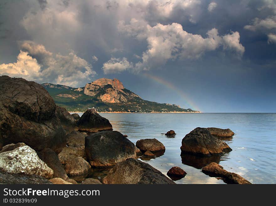 On the horizon was rain, sun illuminated it, and created this miracle - the dawn rainbow. On the horizon was rain, sun illuminated it, and created this miracle - the dawn rainbow