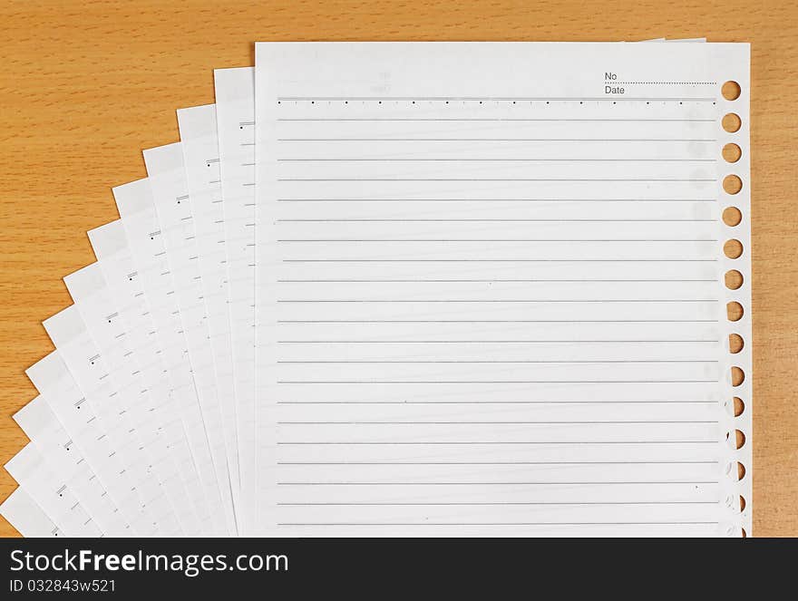 Many white blank paper on the wooden table. Many white blank paper on the wooden table