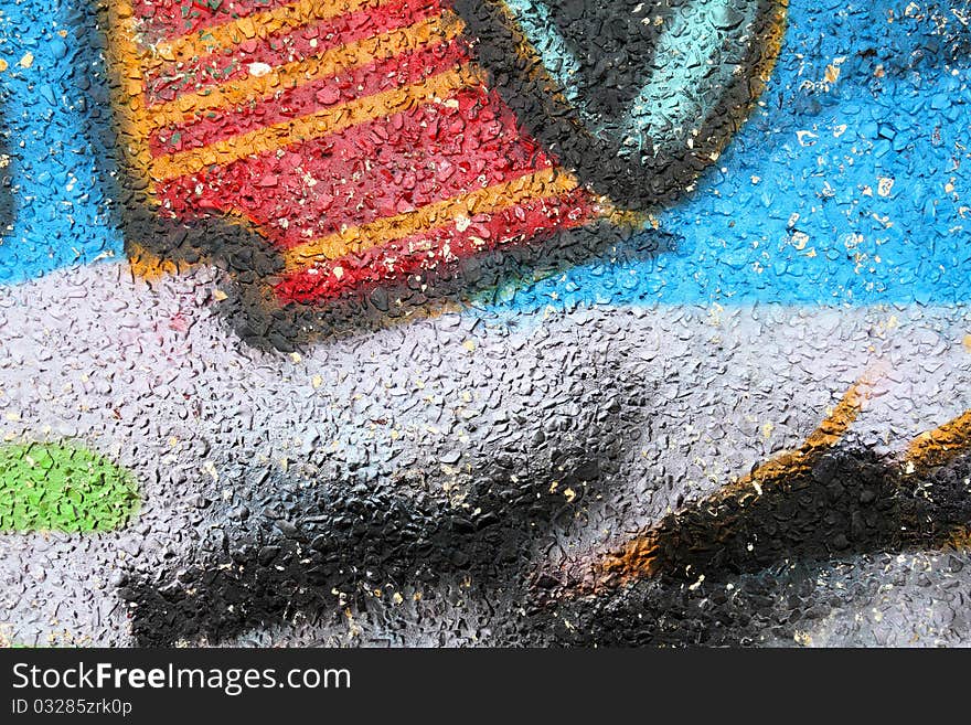 Close up view of colorful graffiti on a stone and cement wall. Close up view of colorful graffiti on a stone and cement wall.