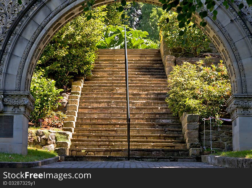 Archway to sunlit stairs