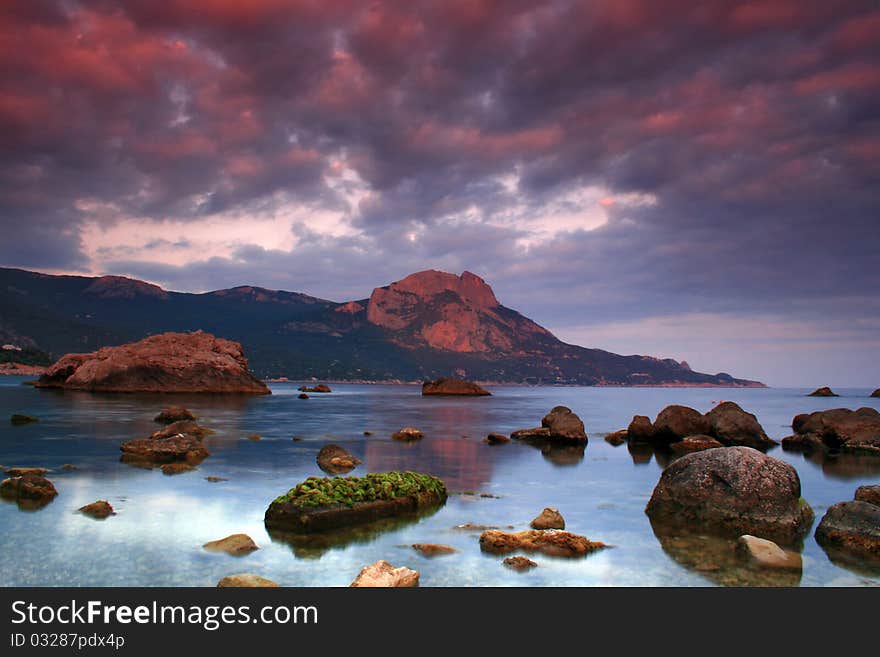 Sunset over the beach with a colorful sky. Sunset over the beach with a colorful sky.