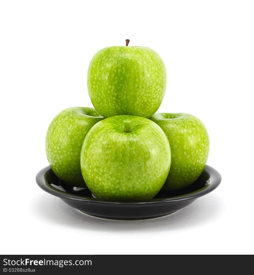 Fresh green apple on plate isolated on white background. Fresh green apple on plate isolated on white background