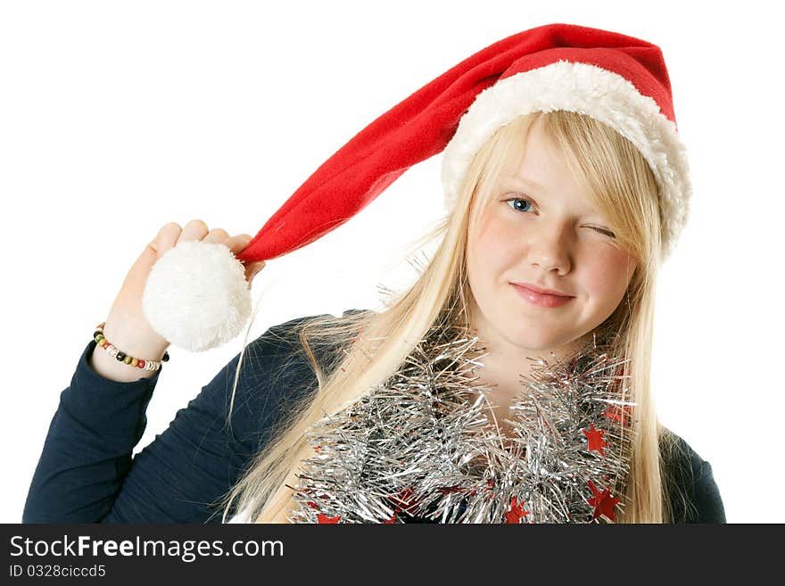 A beautiful young blonde in a Santa hat on a white background