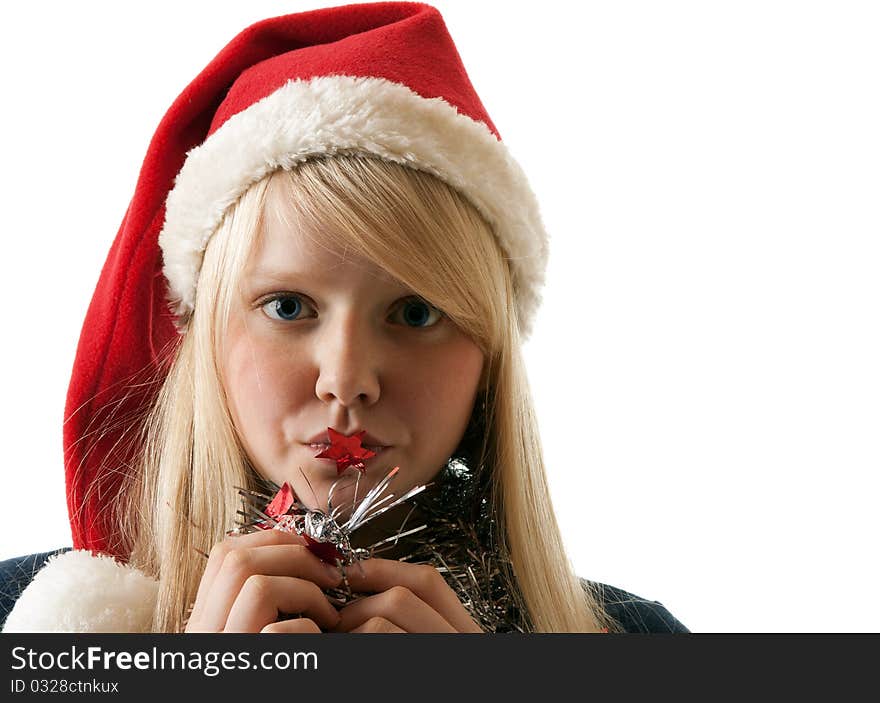 A beautiful young blonde in a Santa hat on a white background