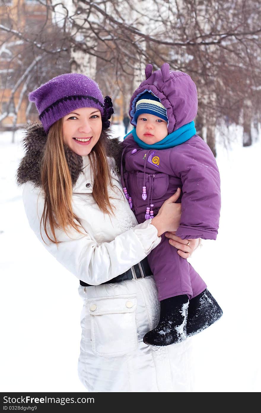 Mother Holding A Baby, Snow, Winter Park