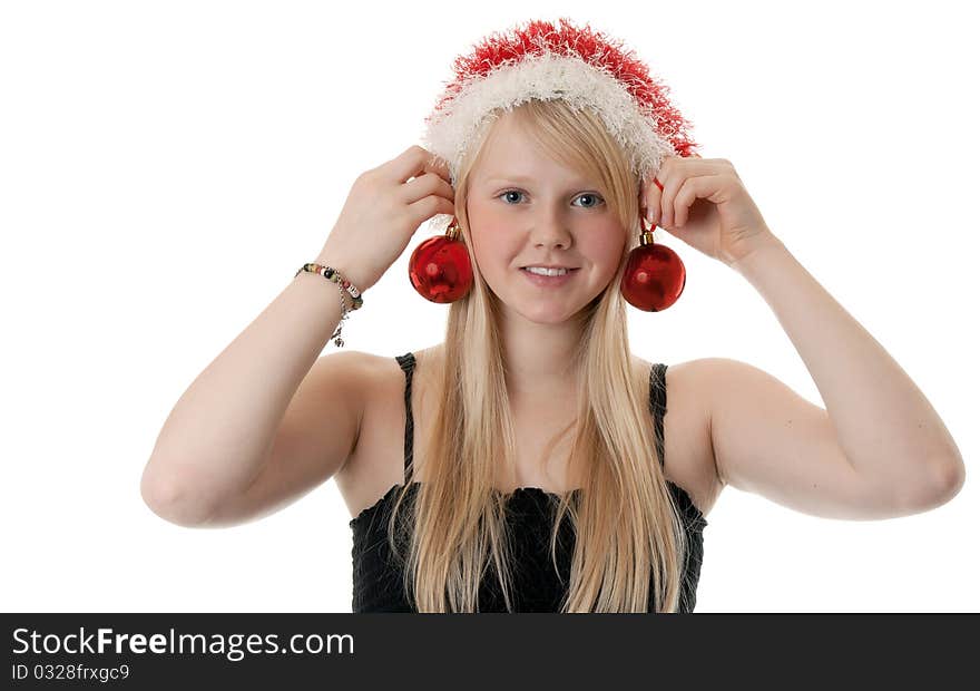 Beautiful blonde girl in a Santa hat on a white background