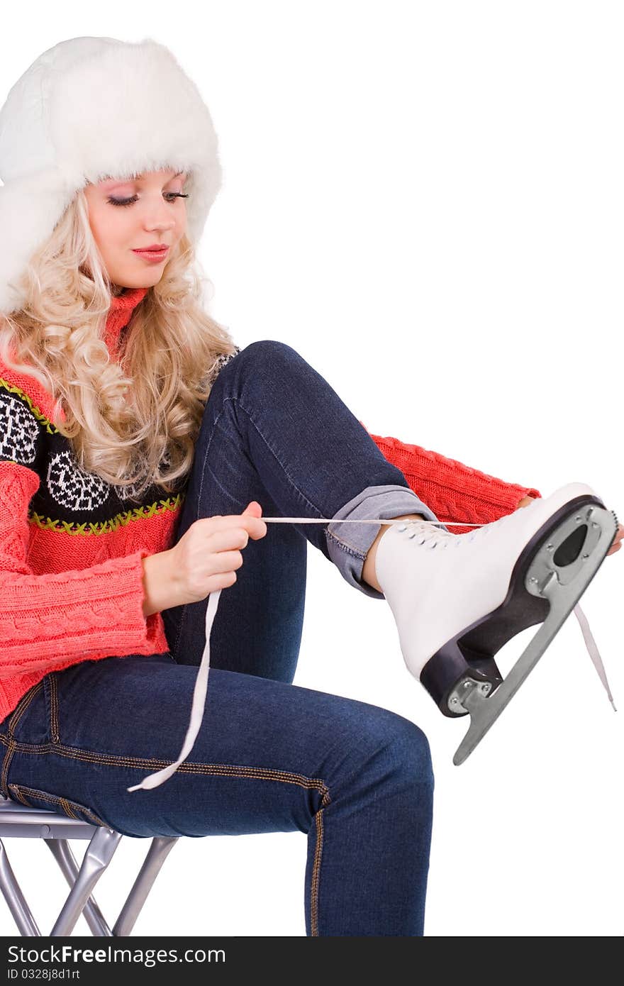 Pretty girl with tying shoelaces of figure skates on white background. Pretty girl with tying shoelaces of figure skates on white background