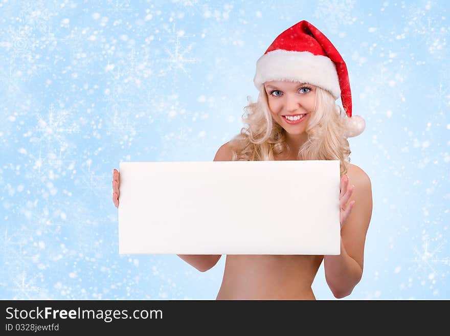 Beautiful christmas woman in santa hat holding empty board