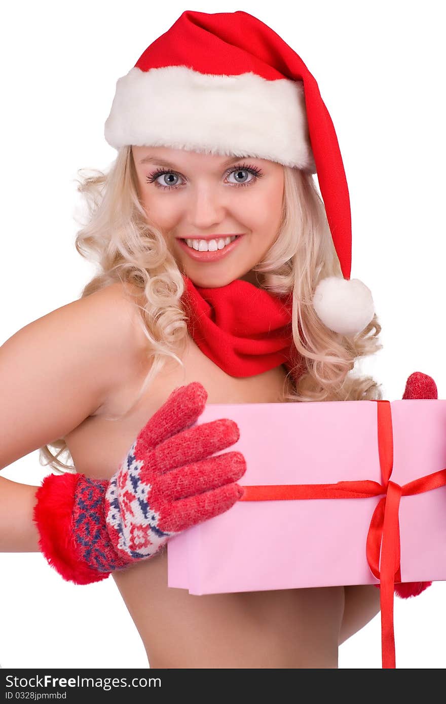 Portrait of a beautiful girl in a Santa hat and gloves with a gift in hands. Portrait of a beautiful girl in a Santa hat and gloves with a gift in hands