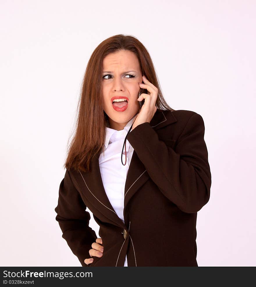 Young attractive secretary talking on the cell phone. Young attractive secretary talking on the cell phone