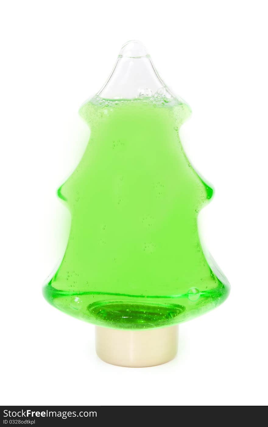 Green shampoo in a bottle in the shape of a Christmas tree