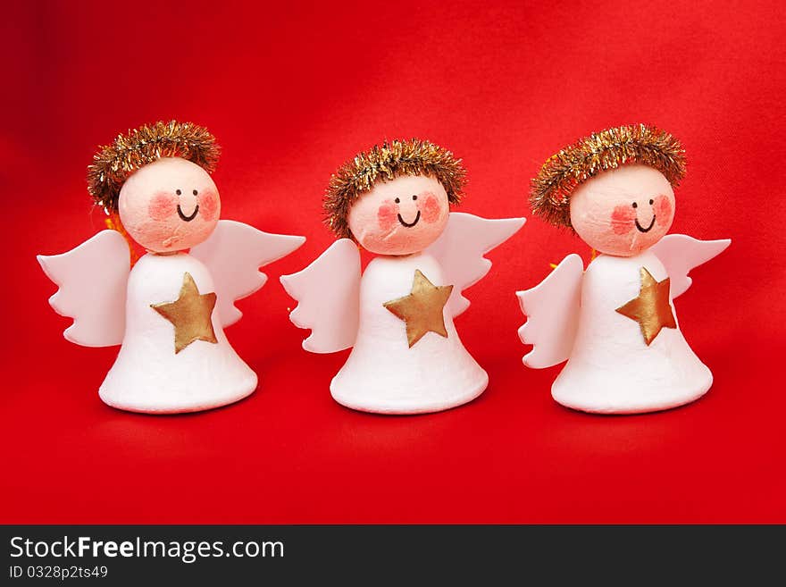 Decorative angel from a set scrapbooking on a red background