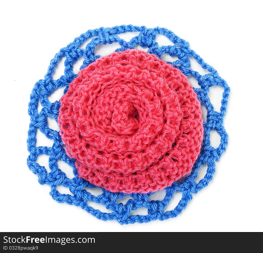 Knitted roses of red and blue thread