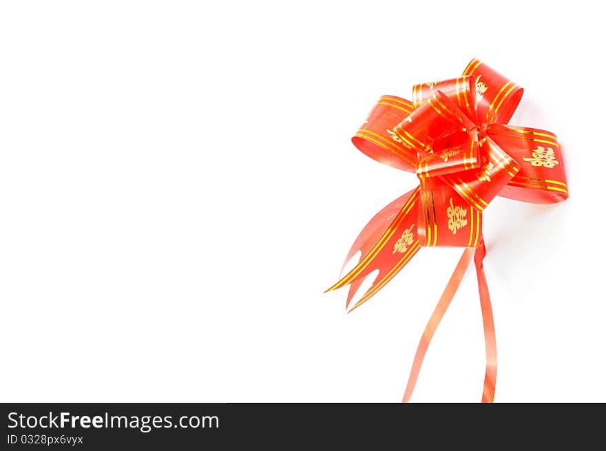 Chinese red auspicious knot isolated on a white background,used for the decorations of wedding invitation cards or new year cards.Blank for text.