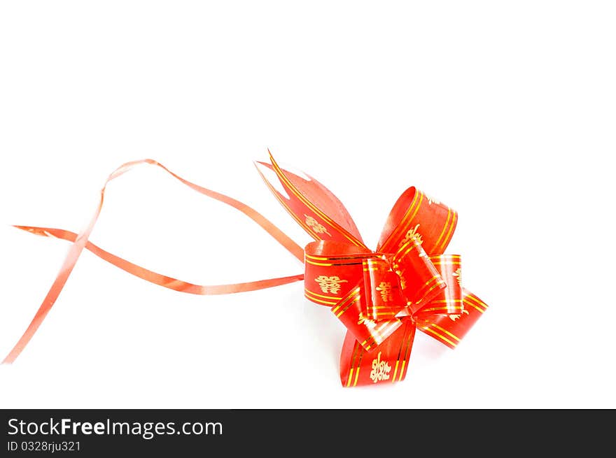 Chinese red auspicious knot isolated on a white background,used for the decorations of wedding invitation cards or new year cards.Blank for text.