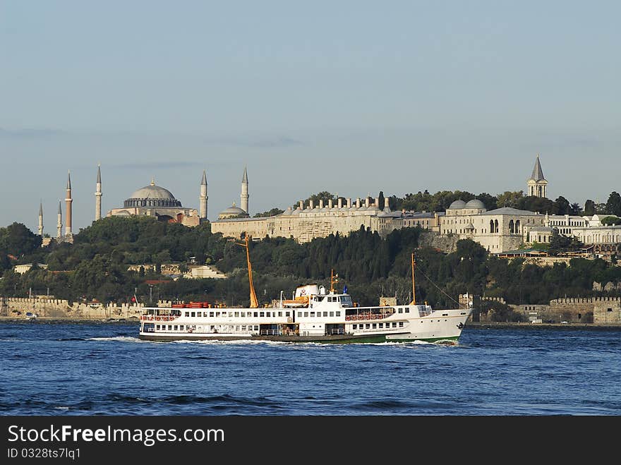 A ferry passing by near topkapi palace and hagia sophia museum