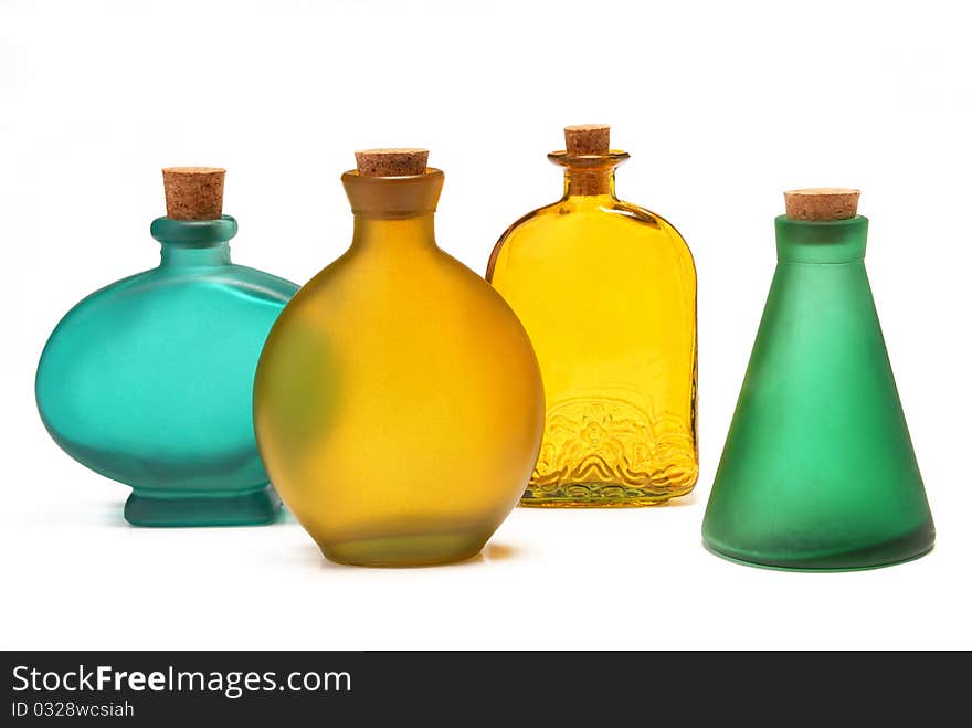 Many different bottles on a white background