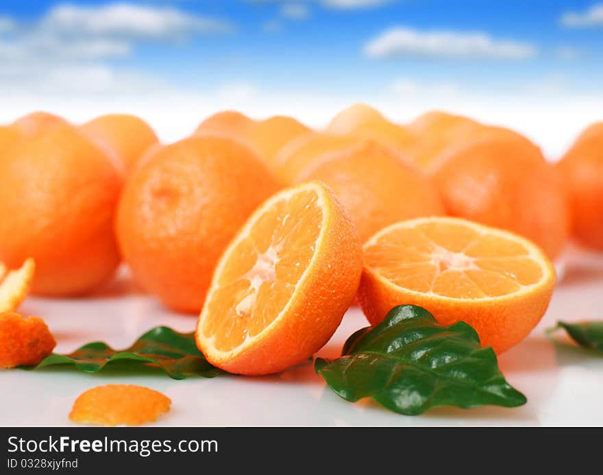 Fresh oranges over blue sky background. Fresh oranges over blue sky background.