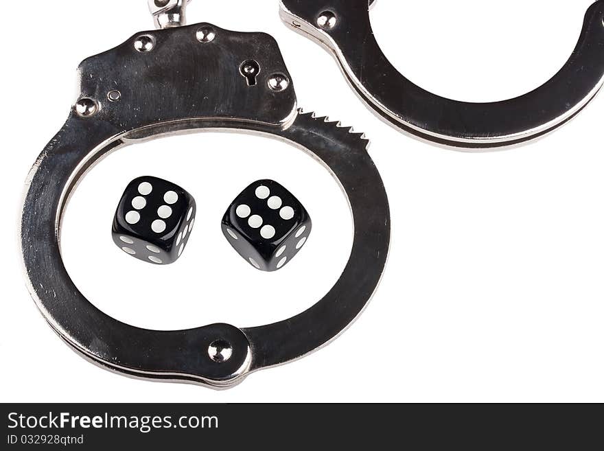 Handcuffs with things gaming - the dice on a white background.