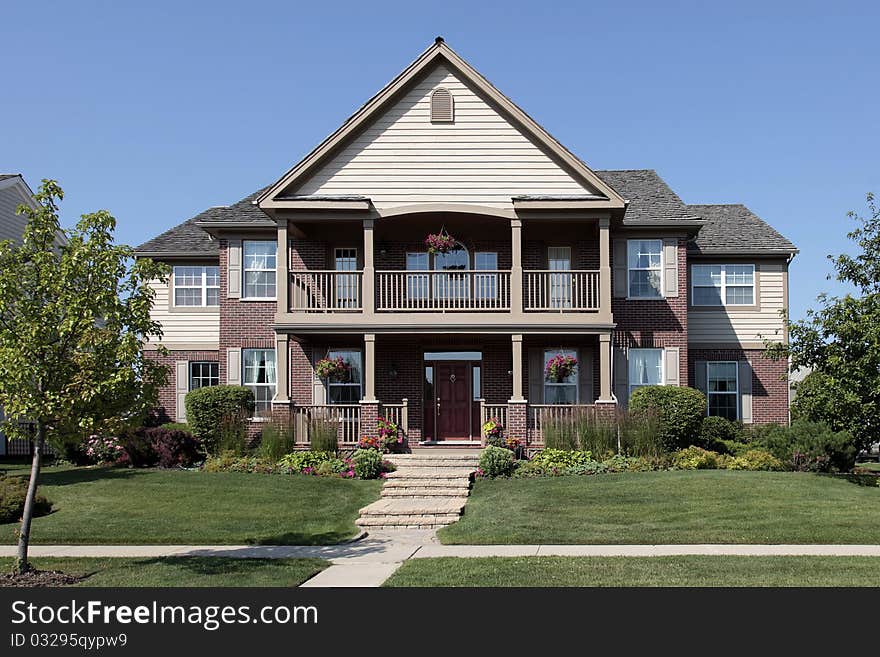 Brick Home With Front Balcony