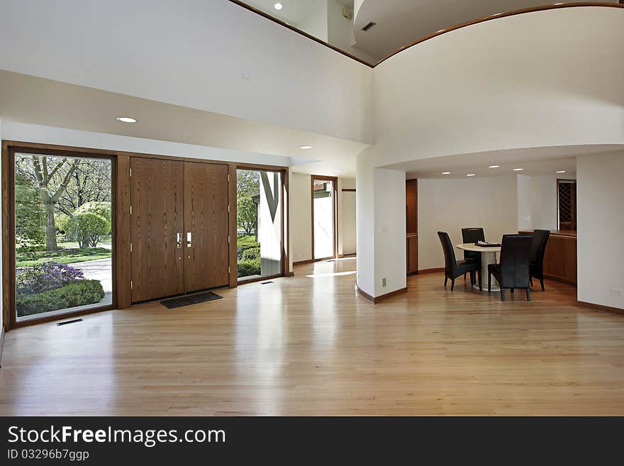 Foyer in luxury home with rounded second floor landing