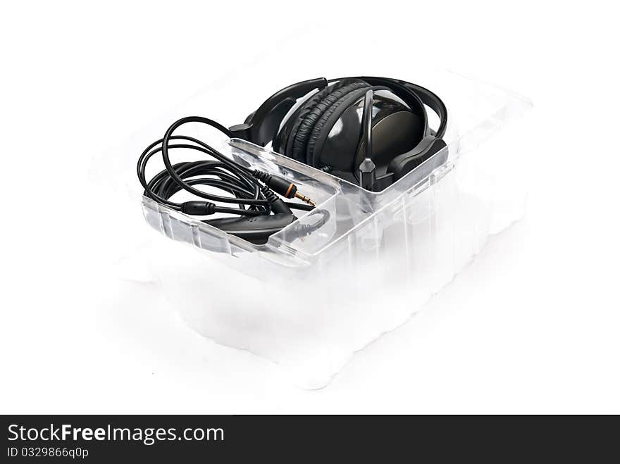 Black headphones in box isolated on white background