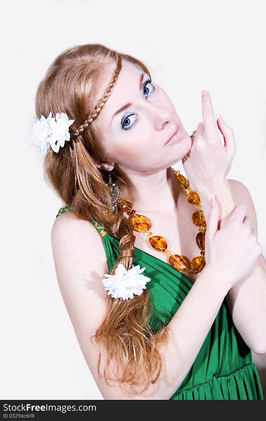 Red-head sensual woman in green dress with flowers