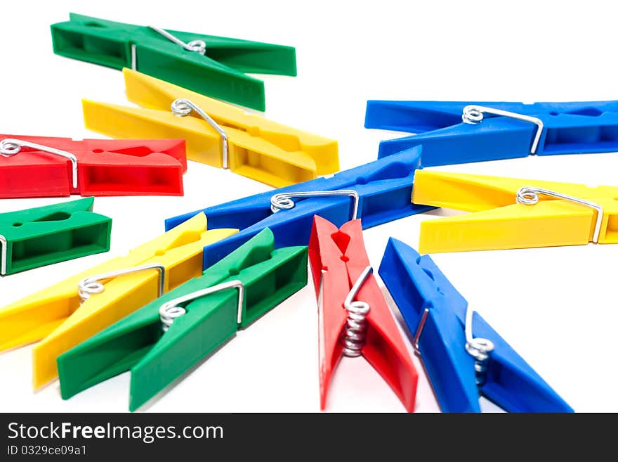 Many colored clothespin isolated on white background