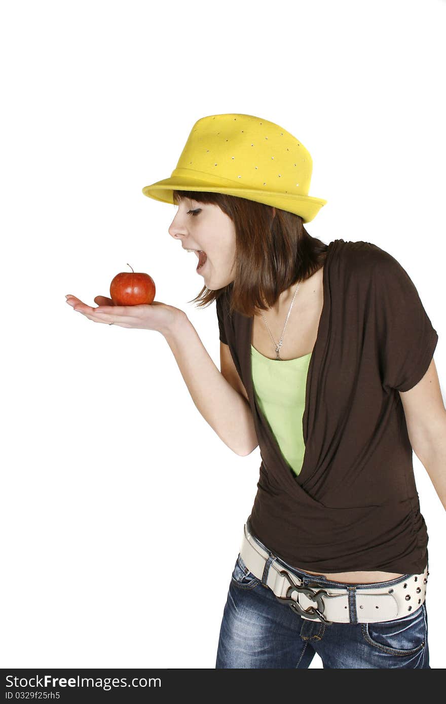 Beautiful girl eating an apple - isolated over white. Beautiful girl eating an apple - isolated over white