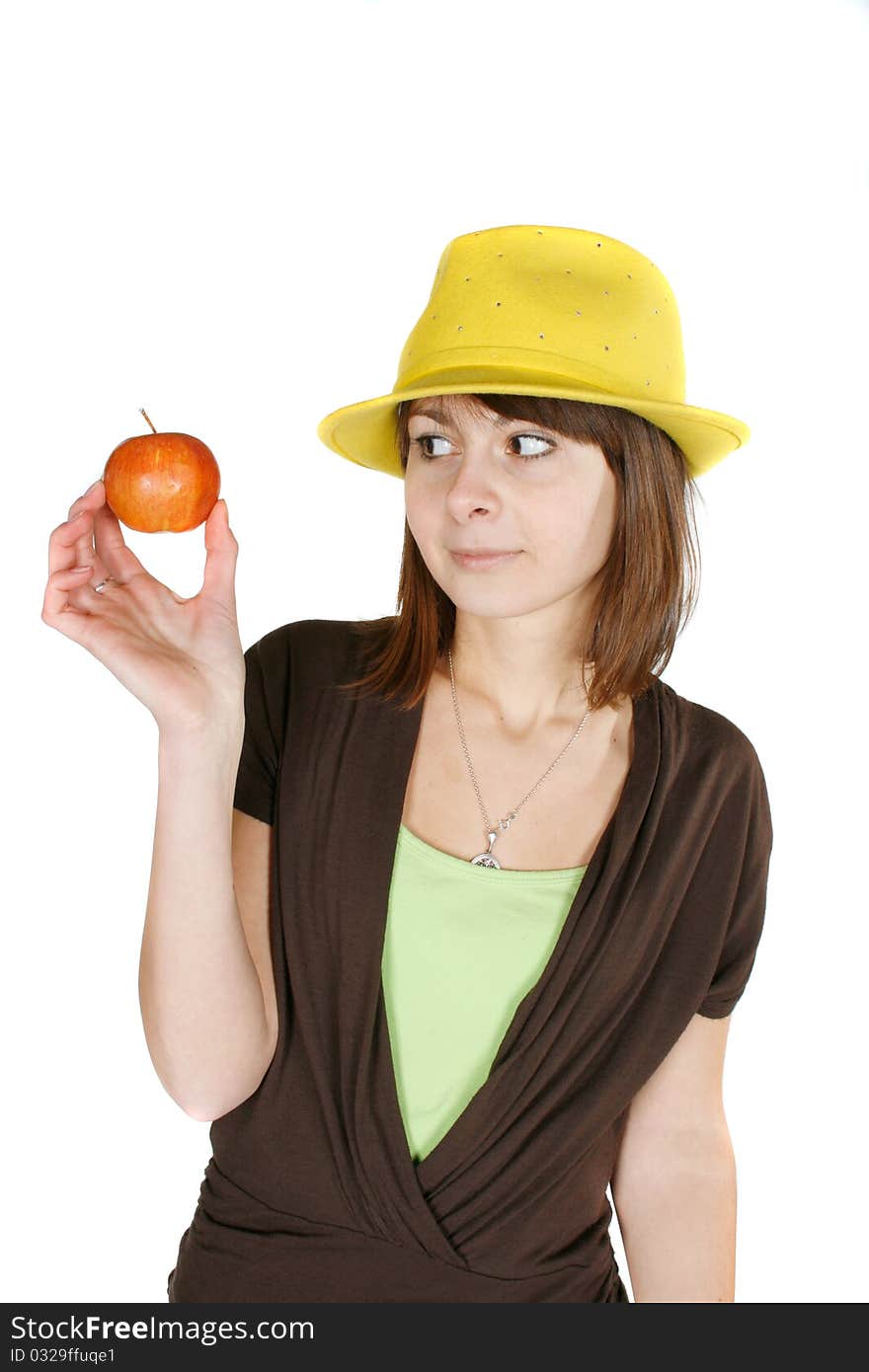 Beautiful girl looking at apple - isolated over white. Beautiful girl looking at apple - isolated over white