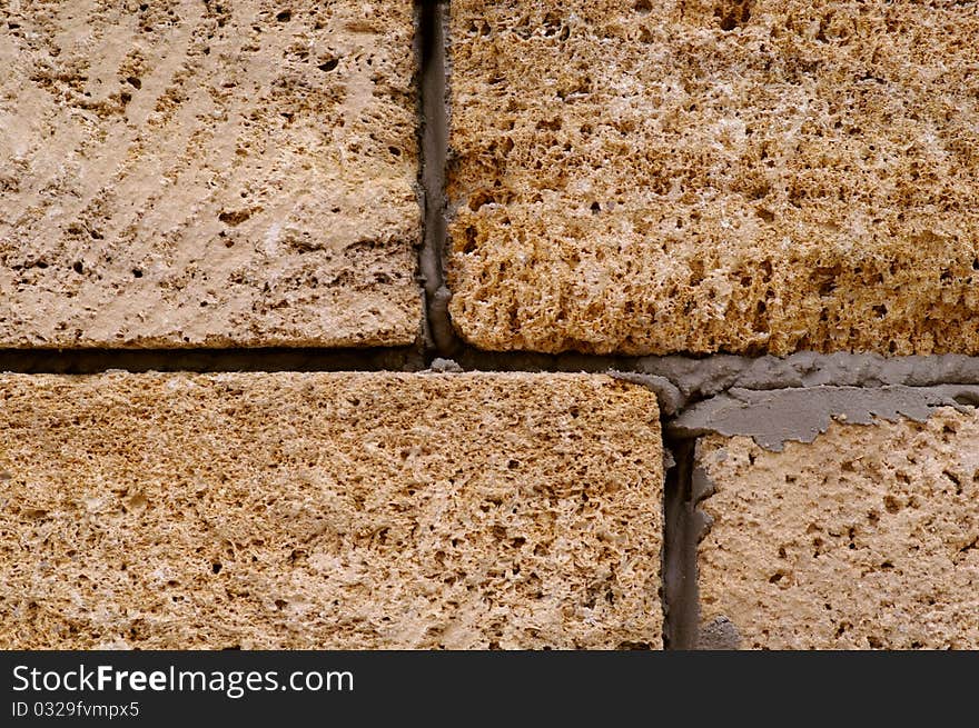 Fragment of brick wall by the closeup