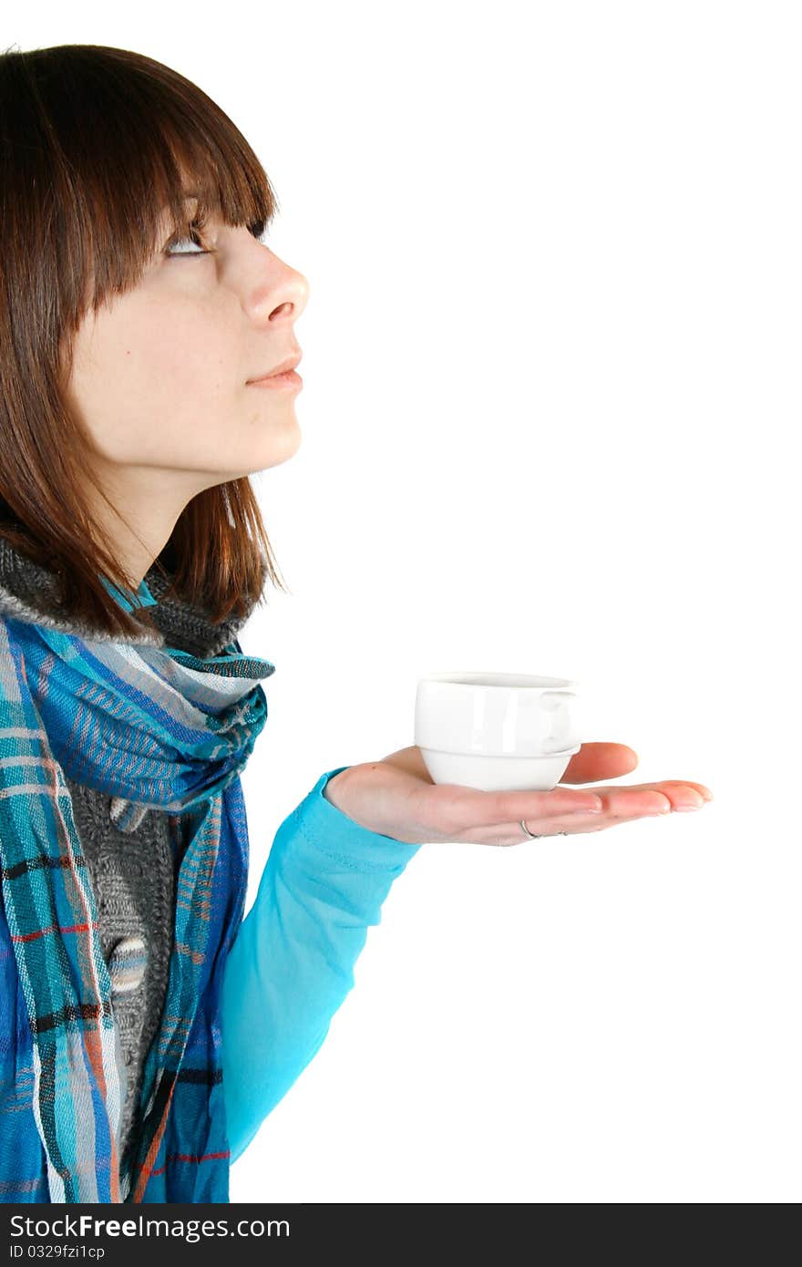 Girl with a cup of tea looking up. Girl with a cup of tea looking up