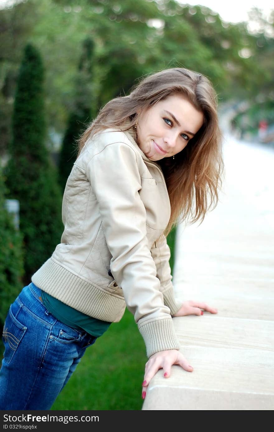 Young attractive girl in the city park. Young attractive girl in the city park