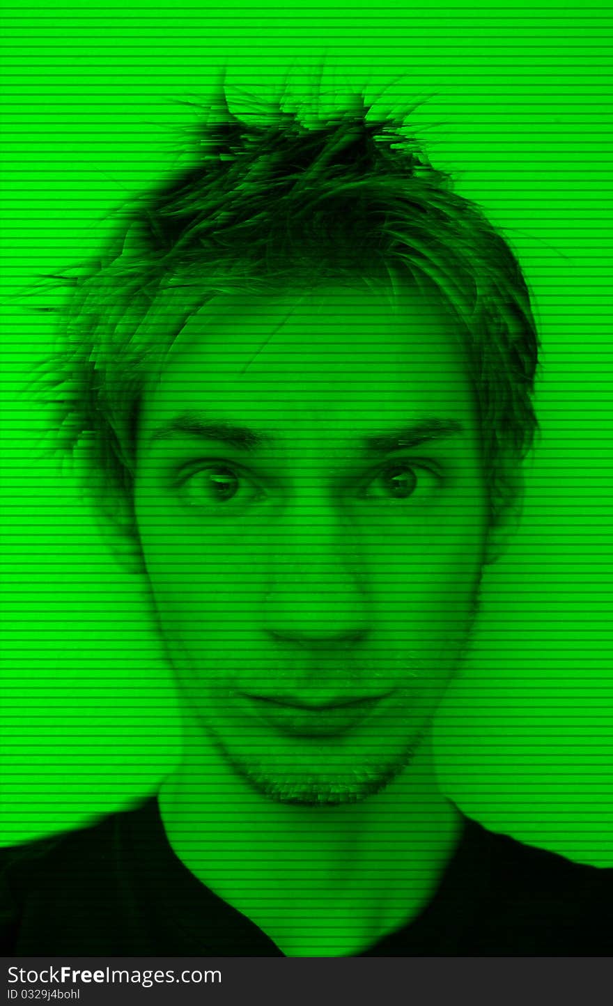 Young man with emo hair looking straight at camera in night vision
