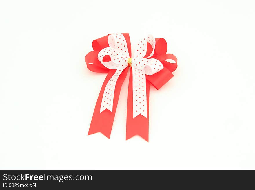 Red And White Bow For Holiday Gift Box Over White