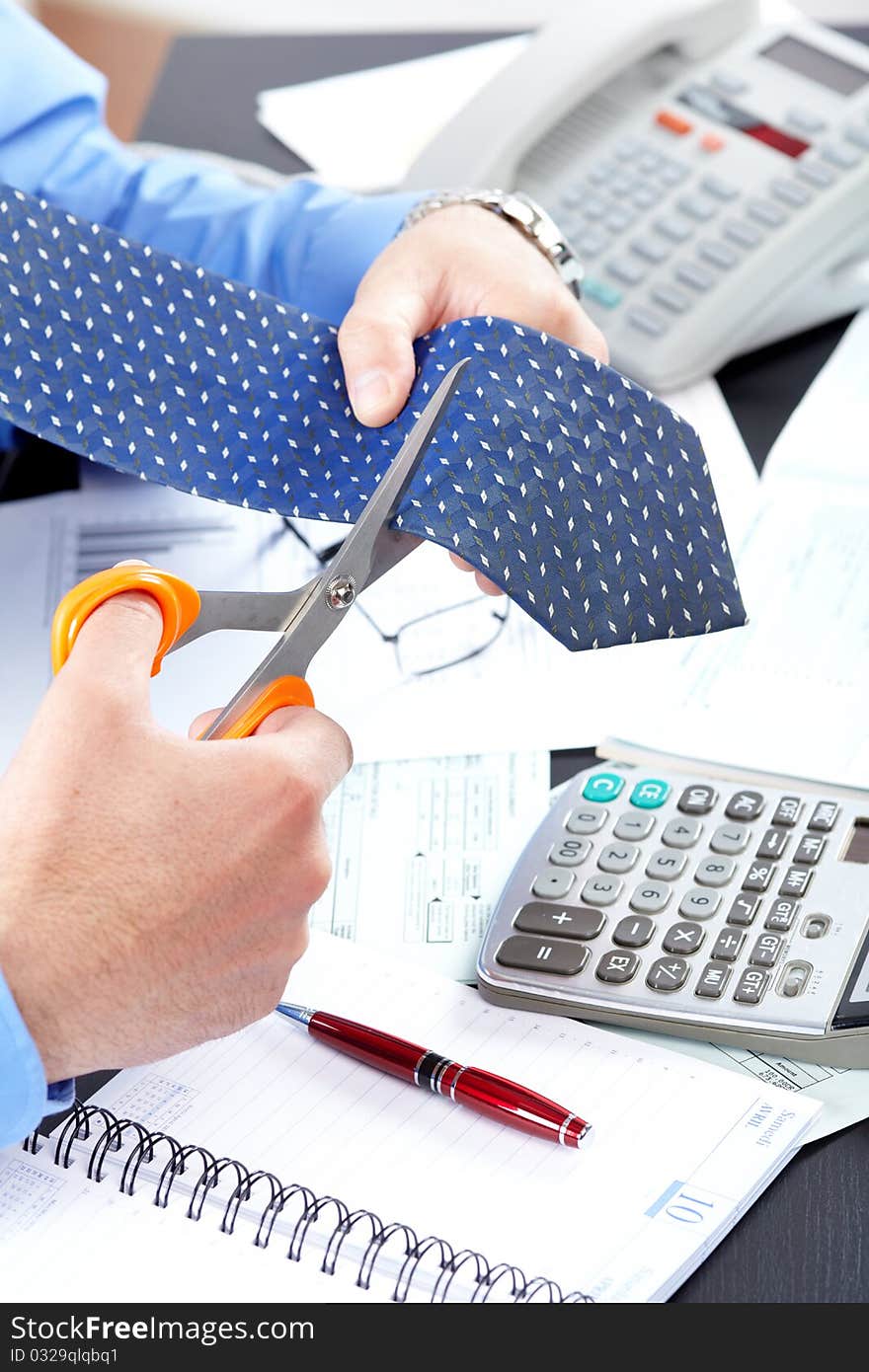 Businessman cutting the tie