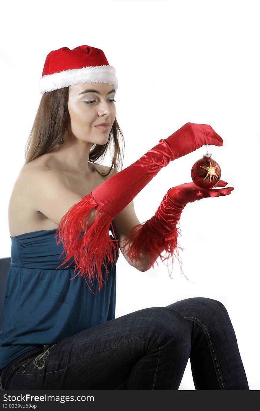 Girl wear Santa hat holding a decoration. Girl wear Santa hat holding a decoration